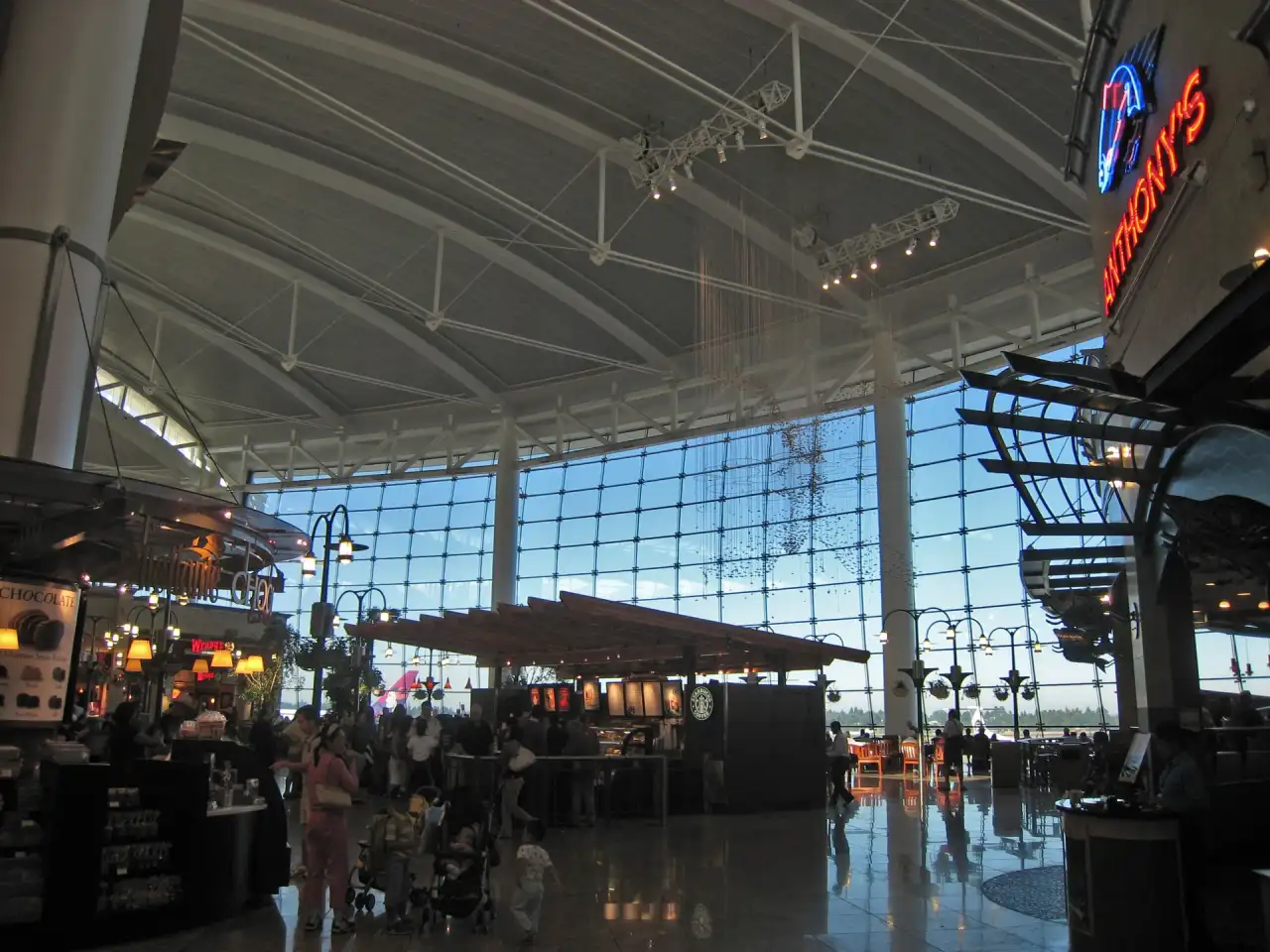 SEA Airport main terminal with shops, travelers and large windows in 2008